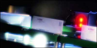 Envelopes on conveyor belt