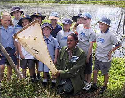 Cathy Freeman and kids inspect Landcare Project at Merri Creek
