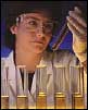 Lab worker with test tubes