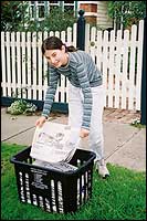 Girl recycling papers