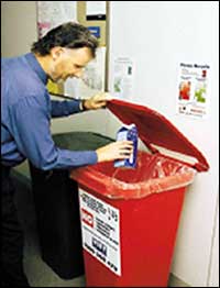 Telstra staff member recycling carton