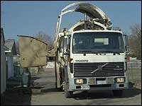 Truck collecting waste for landfill